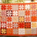 Szerencsés körök takarója, Otthon, lakberendezés, Képzőművészet , Lakástextil, Textil, Varrás, Patchwork, foltvarrás, Négylevelű lóhere mintás patchwork takaró az ősz színeivel. Mérete 132*205 cm, így ideális ágyterítő..., Meska