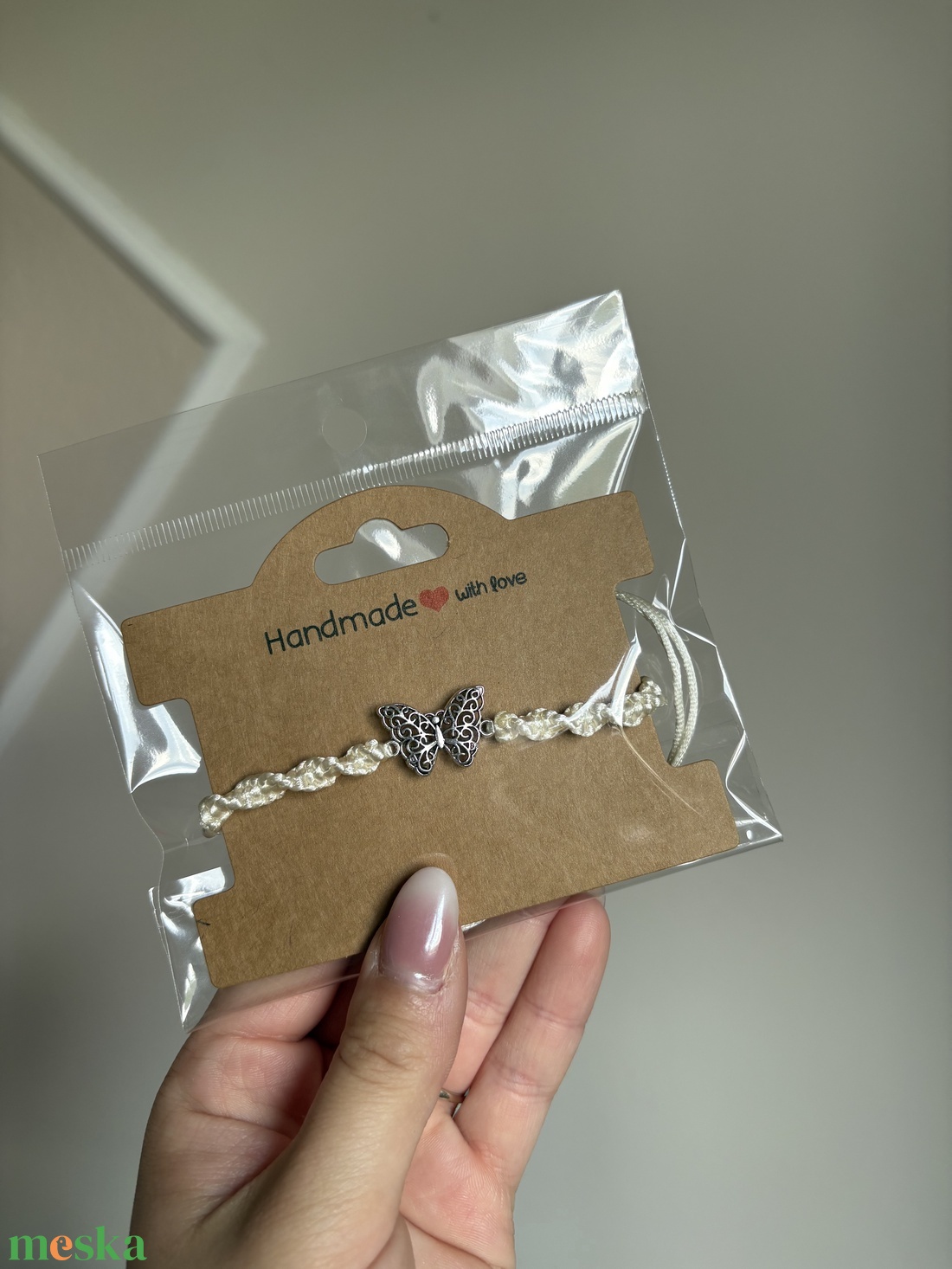 Spirálcsomós pillangós karkötő - ékszer - karkötő - fonott karkötő - Meska.hu