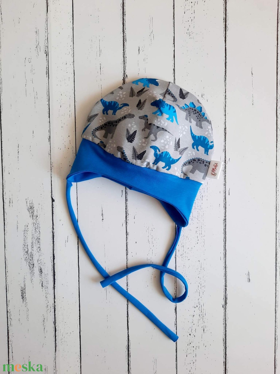 Dínós megkötős fülvédős sapka 49-50 cm - ruha & divat - babaruha & gyerekruha - babasapka - Meska.hu Dínós megkötős fülvédős sapka 49-50 cm - ruha & divat - babaruha & gyerekruha - babasapka - Meska.hu