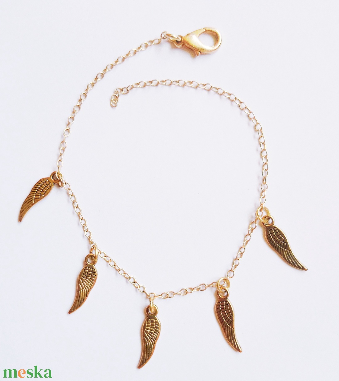 Angyal szárny sor medálos arany színű bokalánc - ékszer - lábdísz és testékszer - bokalánc - Meska.hu Angyal szárny sor medálos arany színű bokalánc - ékszer - lábdísz és testékszer - bokalánc - Meska.hu
