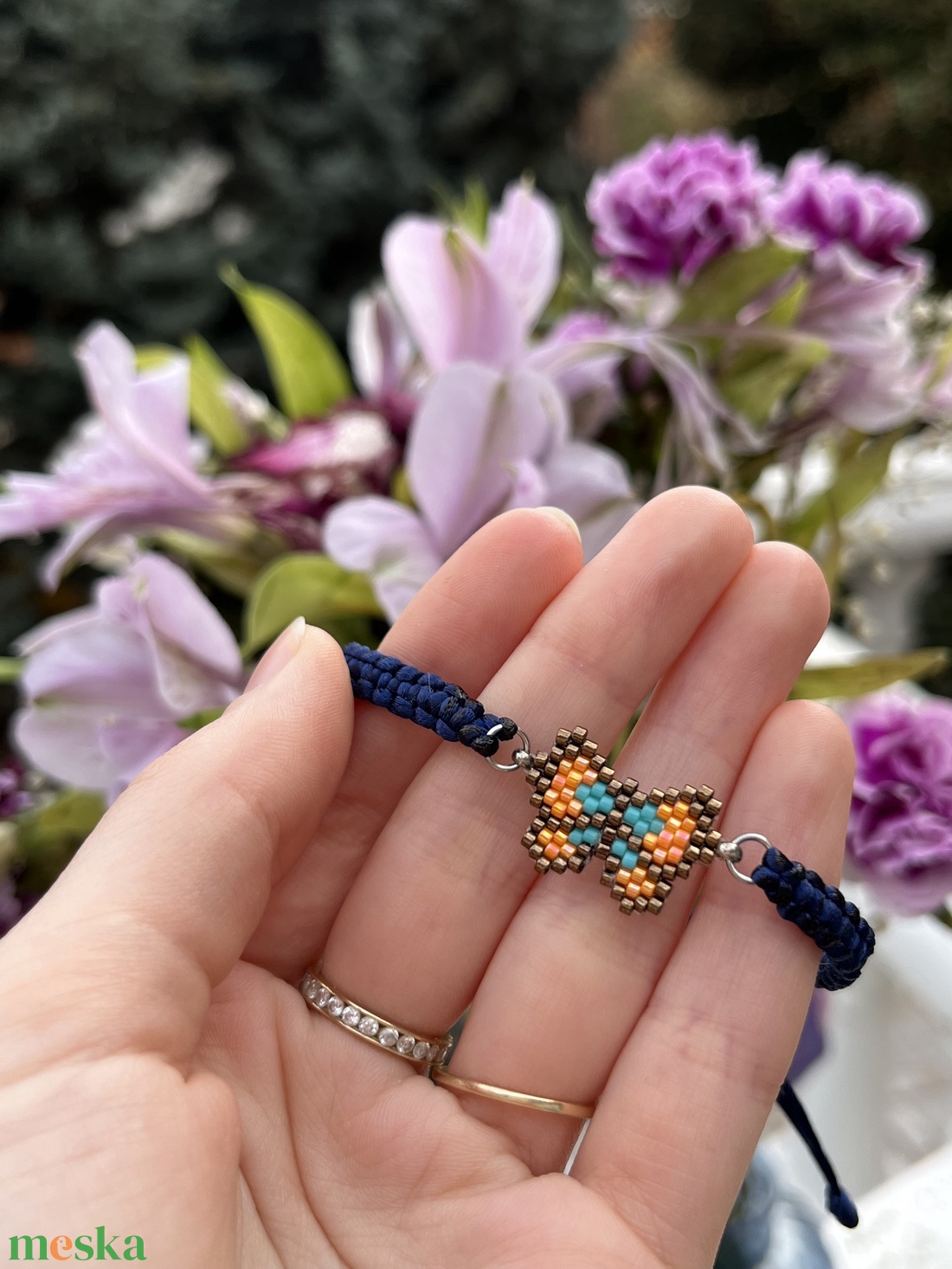 Fonott karkötő bronzszínű-narancssárga gyöngy pillangóval - ékszer - karkötő - fonott karkötő - Meska.hu