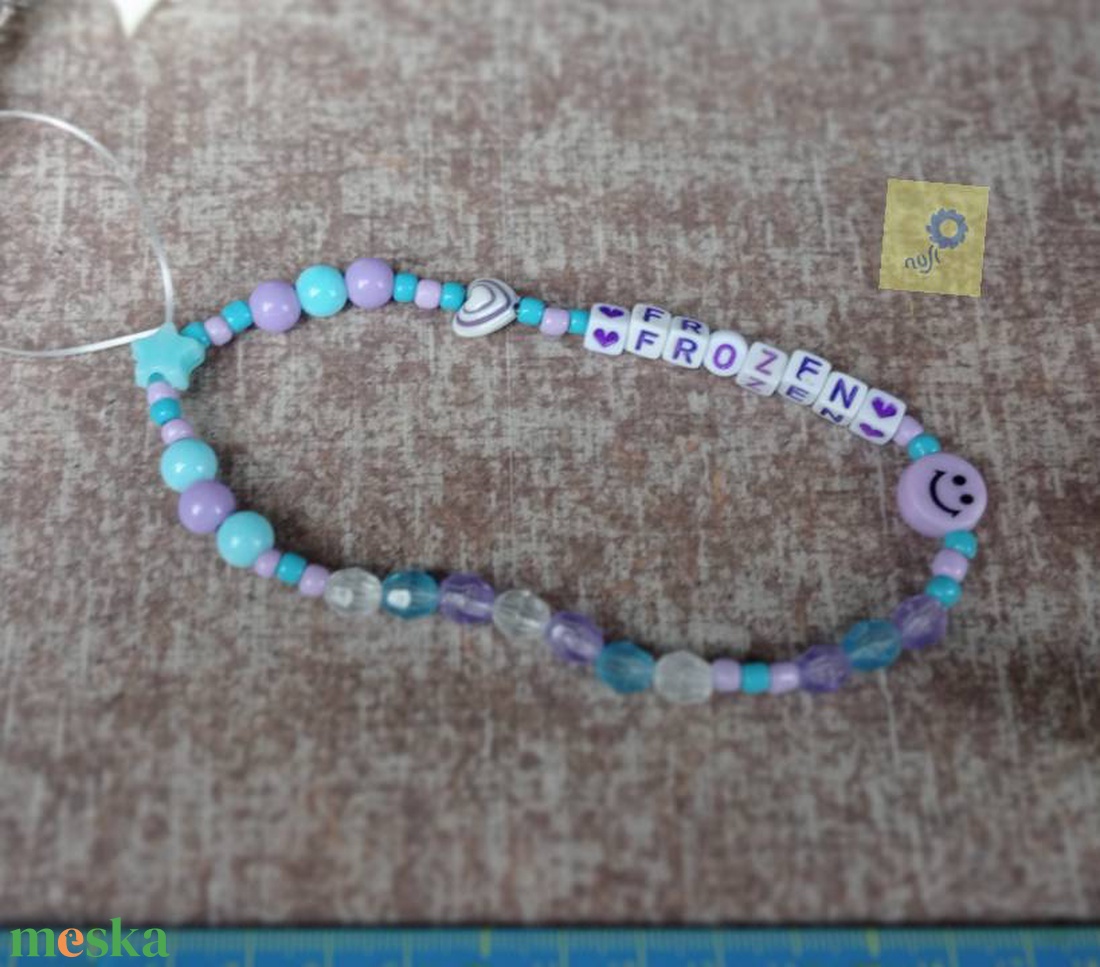 Mobil dísz / phone charm - lila kék árnyalat, frozen felirattal - ékszer - karkötő - charm karkötő - Meska.hu Mobil dísz / phone charm - lila kék árnyalat, frozen felirattal - ékszer - karkötő - charm karkötő - Meska.hu