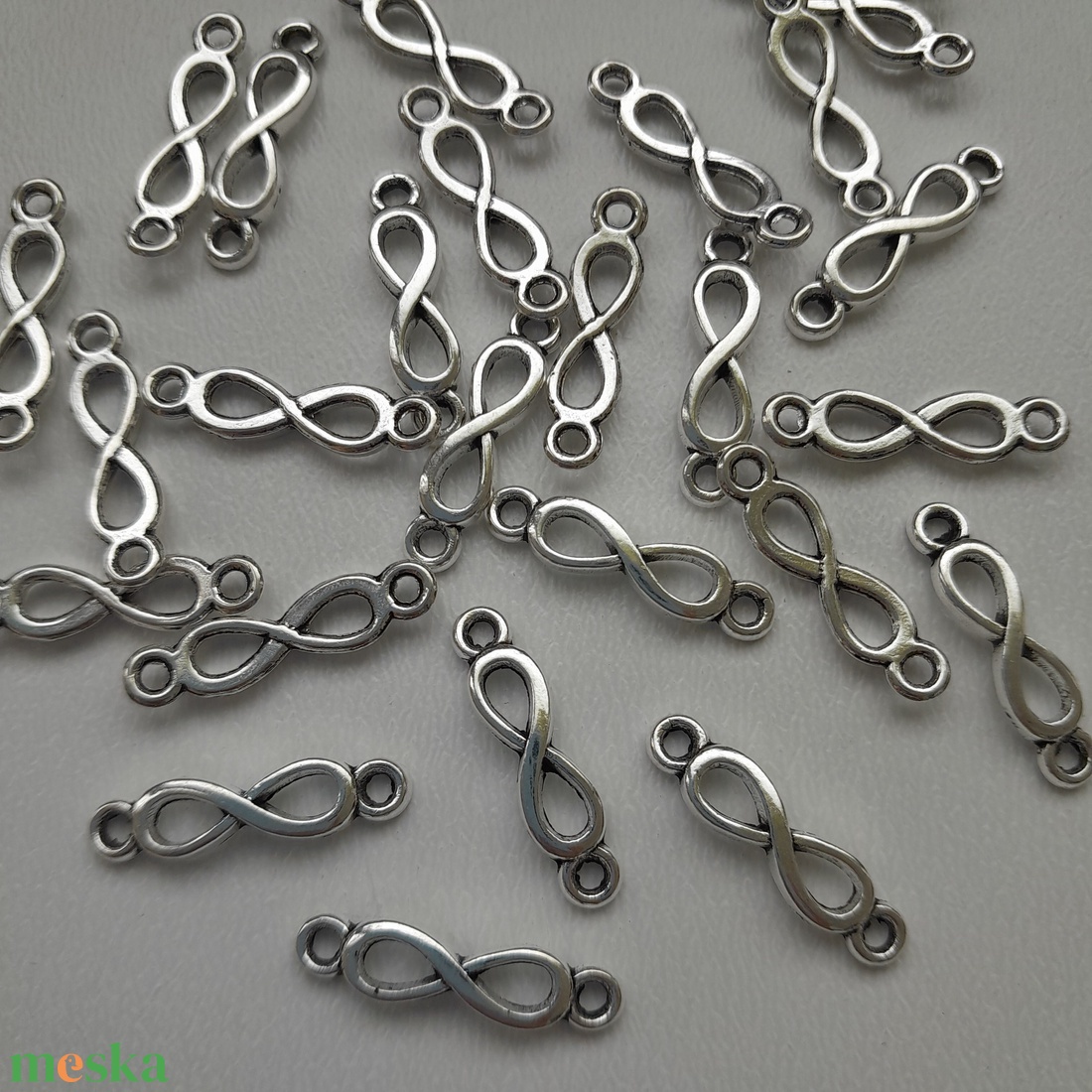 Fém medál, összekötő (íves) - 5x20mm - végtelen jel - 10 db / csomag - antik ezüst szín - kellékek & szerszámok - ékszerkellék - medál csomag - Meska.hu Fém medál, összekötő (íves) - 5x20mm - végtelen jel - 10 db / csomag - antik ezüst szín - kellékek & szerszámok - ékszerkellék - medál csomag - Meska.hu
