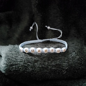 Vízöntő horoszkópos karkötő., Ékszer, Karkötő, Fonott karkötő, Csomózás, MESKA