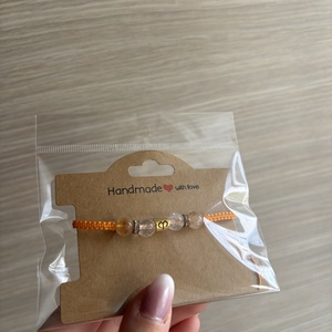 Makramé karkötő - kos medállal - ékszer - karkötő - fonott karkötő - Meska.hu