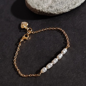 Édesvízi tenyésztett gyöngy nemesacél karkötő - Meska.hu