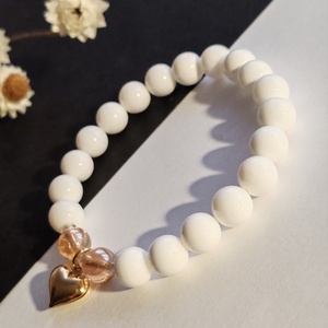 Kagylógyöngy - arany aurakvarc gumis karkötő  - ékszer - karkötő - gyöngyös karkötő - Meska.hu