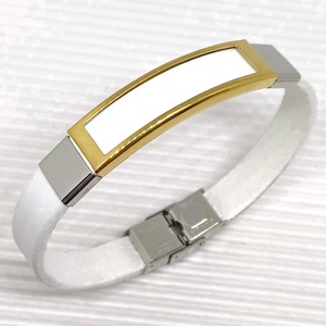 Golden eye ezüst fényben fehér bőr/nemesacél karkötő, nőknek - ékszer - karkötő - karkötő medállal - Meska.hu