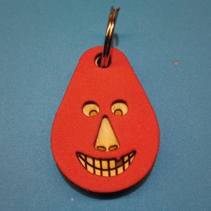 Piros, Vidám Busó kulcstartó. Gumírozott felület, gravírozott alappal. Vidámaknak jár, búsulóknak vidító ajándék. - Meska.hu