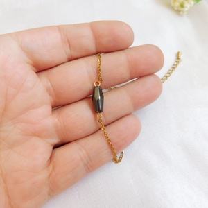 Acél karkötő hematittal - ékszer - nyaklánc - medál - Meska.hu