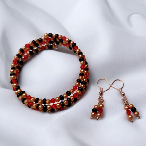 Piros arany fekete gyöngyös memoria karkötő  - ékszer - karkötő - memóriadrótos karkötő - Meska.hu