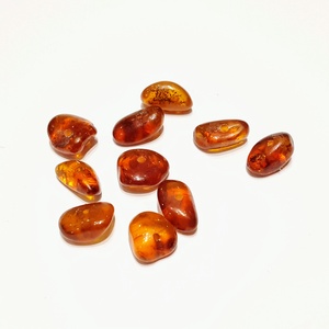 Csiszolt borostyán kövek kifurva - kellékek & szerszámok - gyöngyfűzés kellékek - féldrágakő - Meska.hu