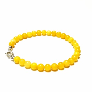 Borostyán gömb karkötő pici gyöngyökből sárga opak - ékszer - ékszerszett - Meska.hu