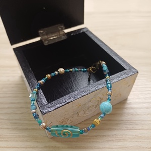 Türkizkék-arany karkötő keleti hangulatban - ékszer - karkötő - gyöngyös karkötő - Meska.hu