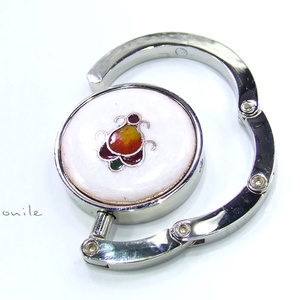 Virágos fehér-narancs tűzzománc táskatartó -  - Meska.hu