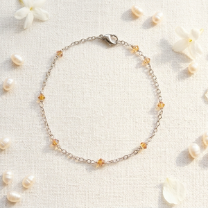Napfény Csepp karkötő � kézzel készített, borostyán-aranysárga Swarovski kristálygyöngyös, 316L nemesacél lánccal, egyed - Meska.hu