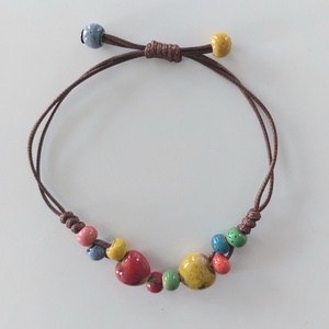 Makramé karkötő kerámia gyöngyökkel  - ékszer - karkötő - fonott karkötő - Meska.hu