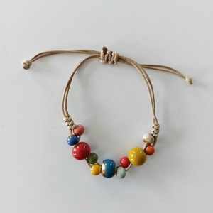 Makramé karkötő kerámia gyöngyökkel  - ékszer - karkötő - fonott karkötő - Meska.hu