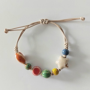 Makramé karkötő különböző formájú kerámia gyöngyökkel - ékszer - karkötő - fonott karkötő - Meska.hu