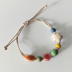 Makramé karkötő különböző formájú kerámia gyöngyökkel - ékszer - karkötő - fonott karkötő - Meska.hu