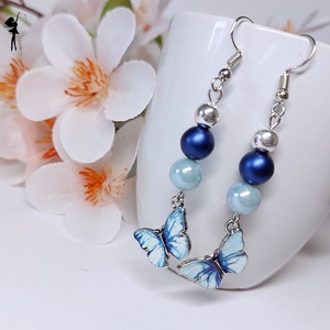 Tűzzománc pillangós fülbevaló világos és sötétkék swarovski gyönggyel - ékszer - fülbevaló - lógó fülbevaló - Meska.hu